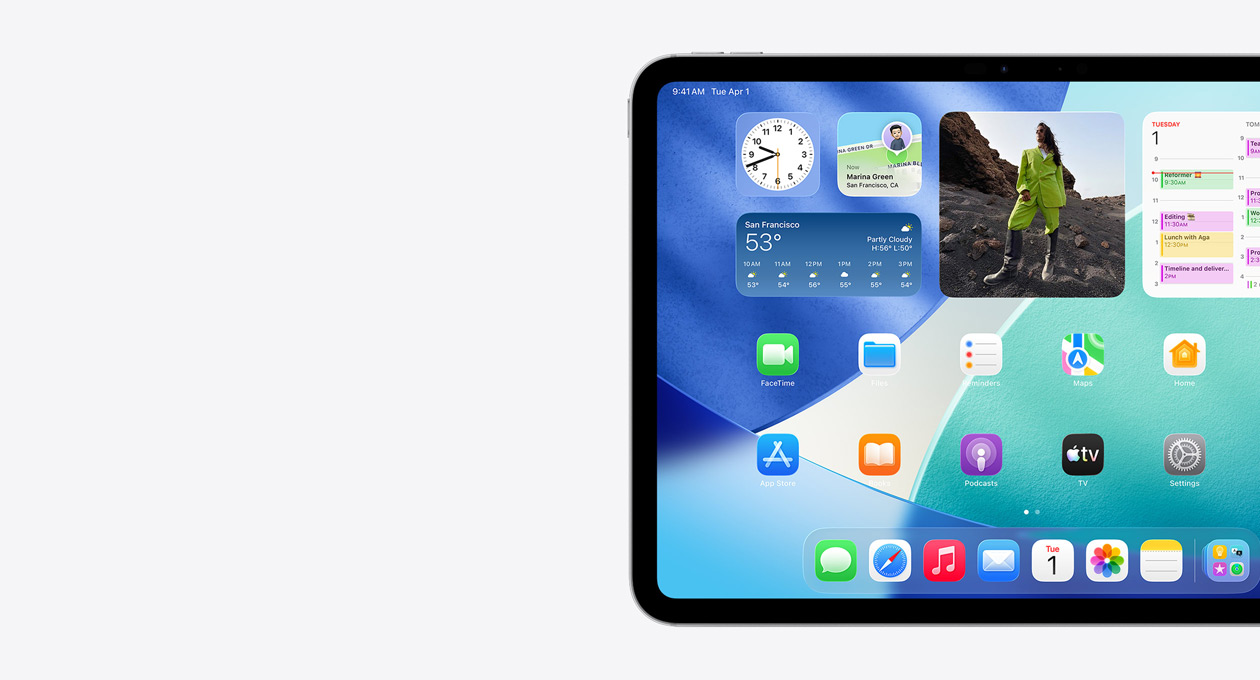 iPad, landscape orientation, left side of screen only, Home Screen with stacked widgets including translucent clock showing Liquid Glass effect, Find My app, Weather widget, two rows of smaller apps, and the Dock